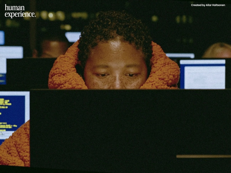 Human Experience · by Allar Haltsonen · captioned image, screen glow, office crop