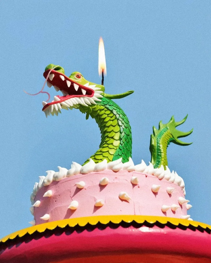 Dragon Cake · by Laura Baiardini · dragon cake, birthday candle, blue sky
