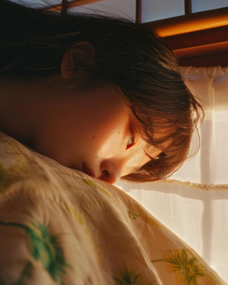 The Nap · by Léo Cannone · sunlit portrait, morning light, soft bedding