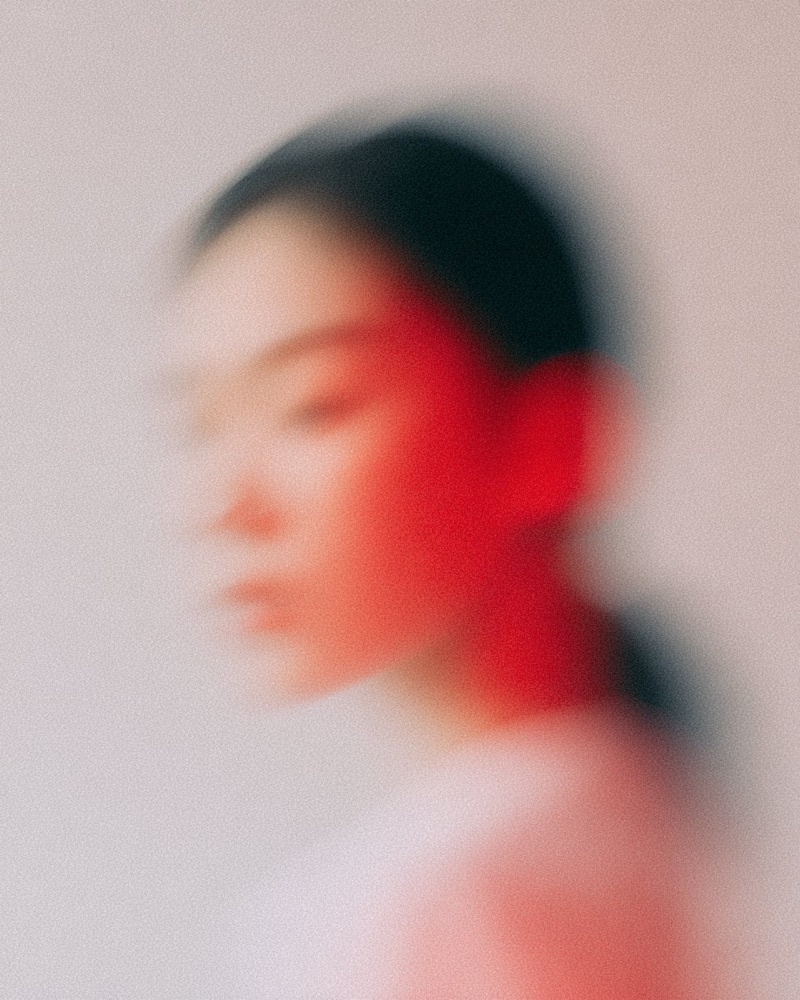 Red Blur Portrait · by Floow.ai · blurred portrait, red light, soft profile