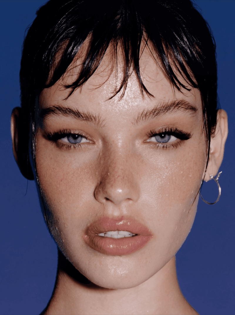 Blue Flash Face · by Jamey Gannon · face close-up, blue background, flash portrait